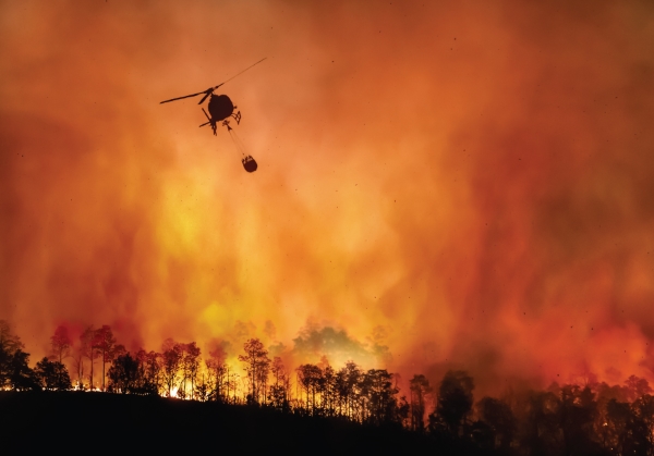 A helicopter fighting a wildfire