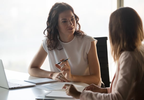 An insurance professional interviews a customer