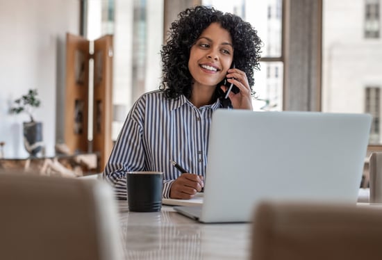 person on phone smiling
