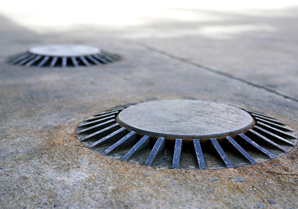 Underground storage tank lids on the ground