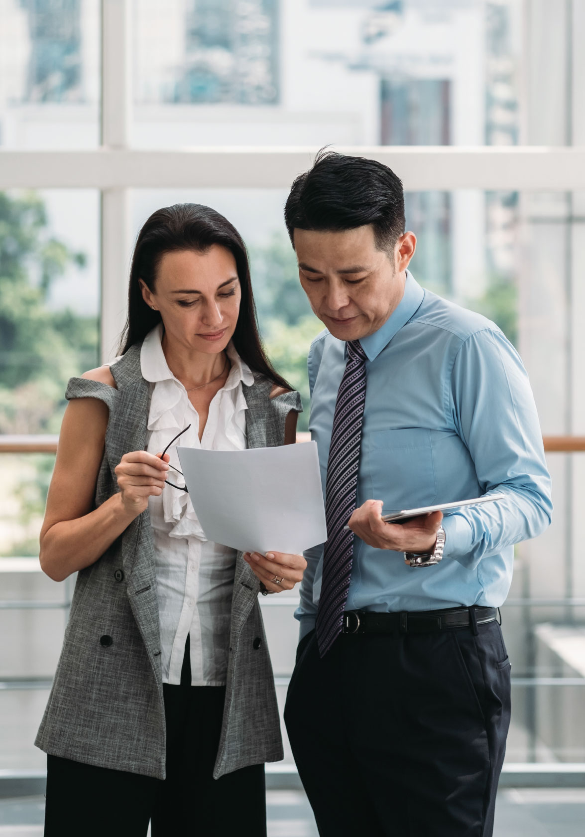 two people looking at a document